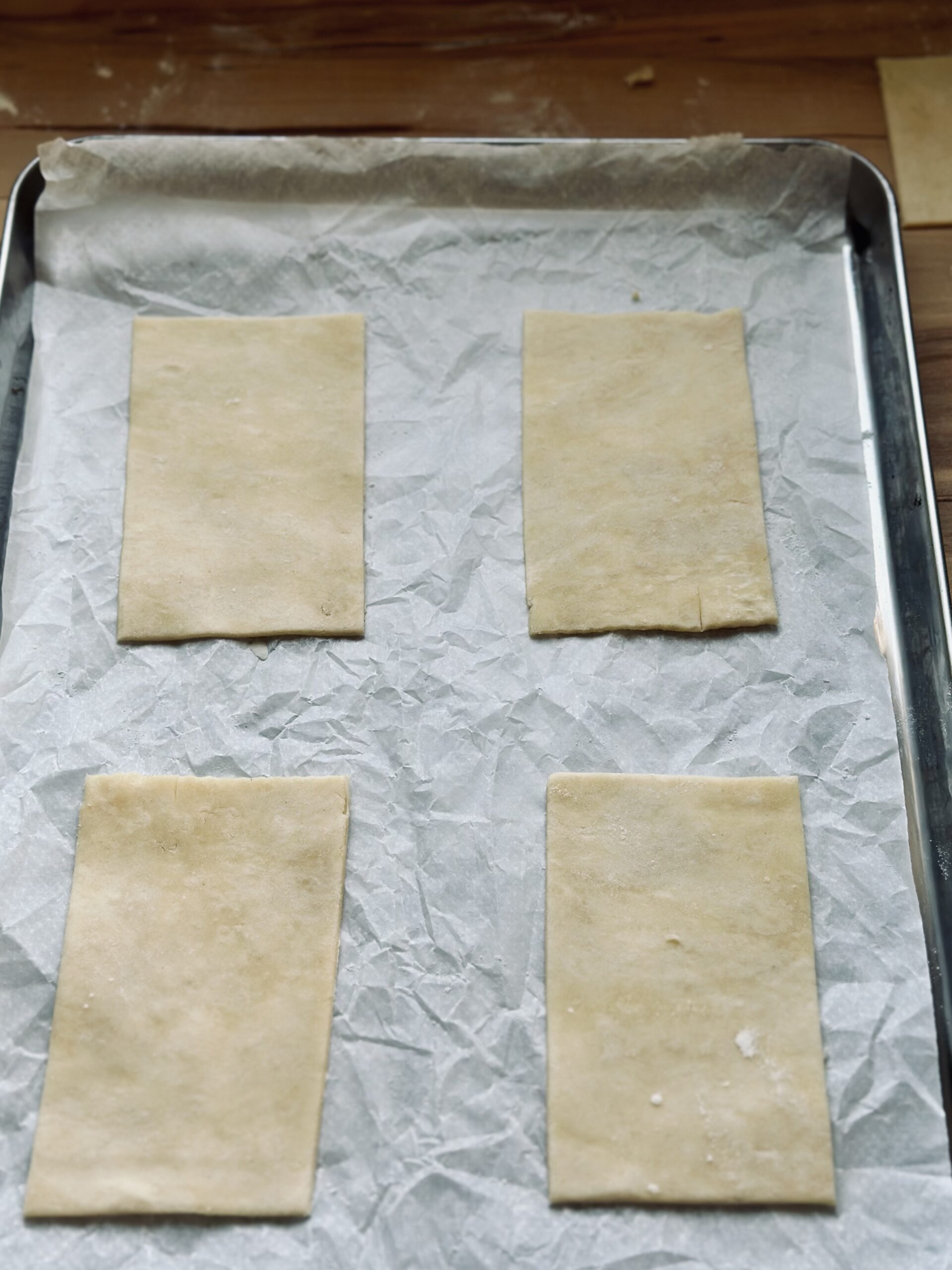 Teiglinge auf ein Backblech mit Backpapier legen