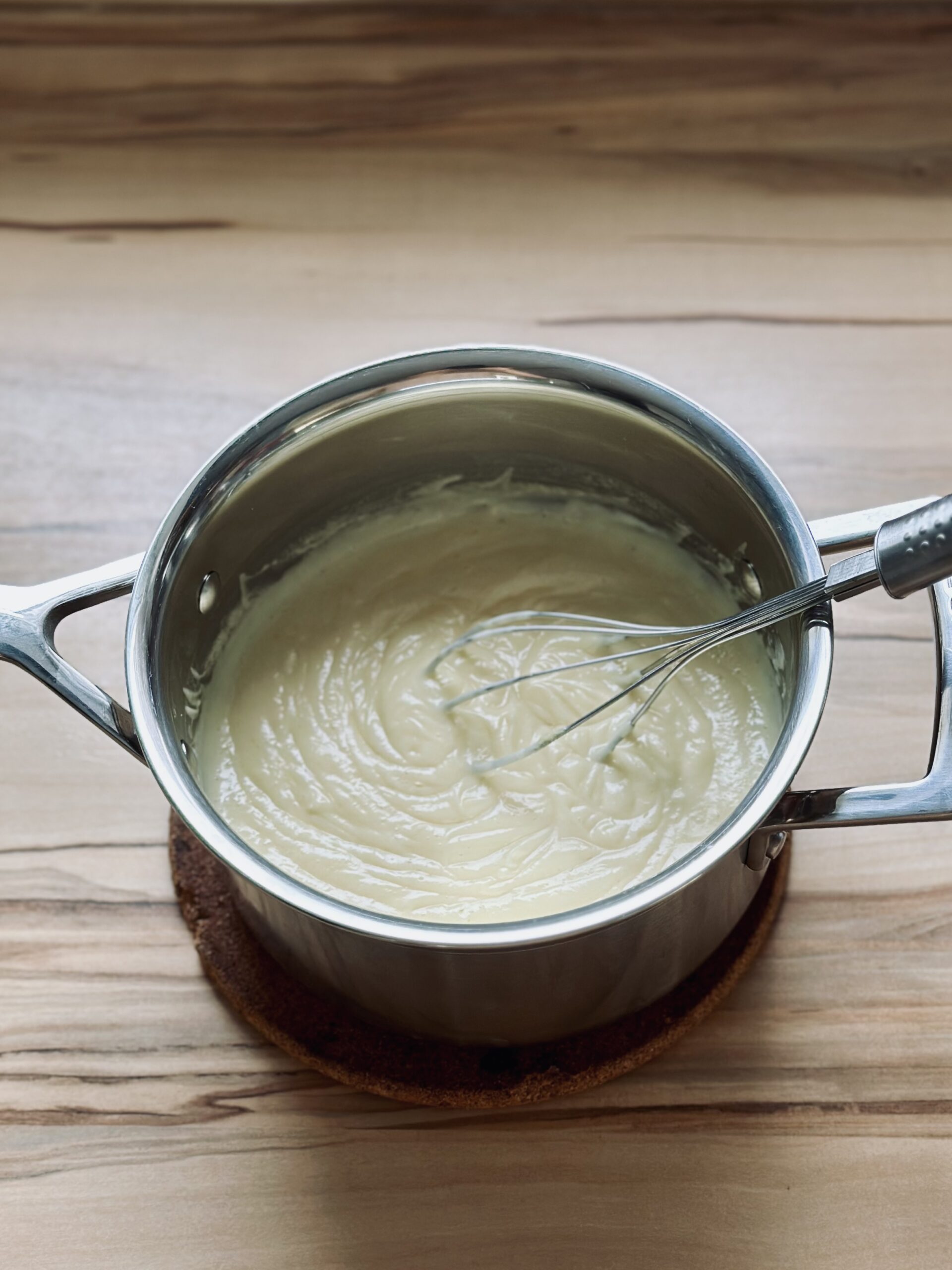 Vanillepudding gut verrühren und kurz aufkochen.