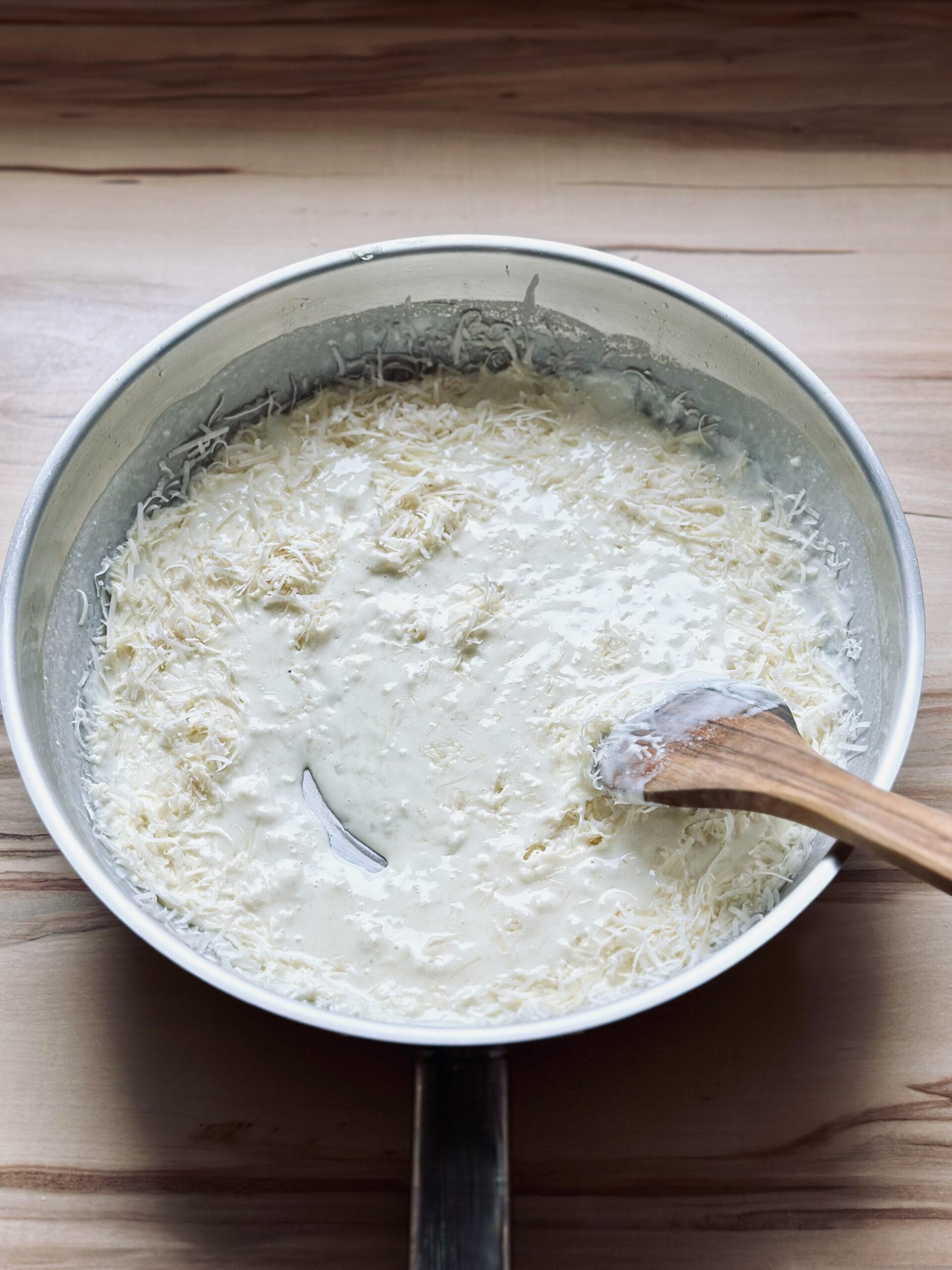 Käse einrühren bis er geschmolzen ist.